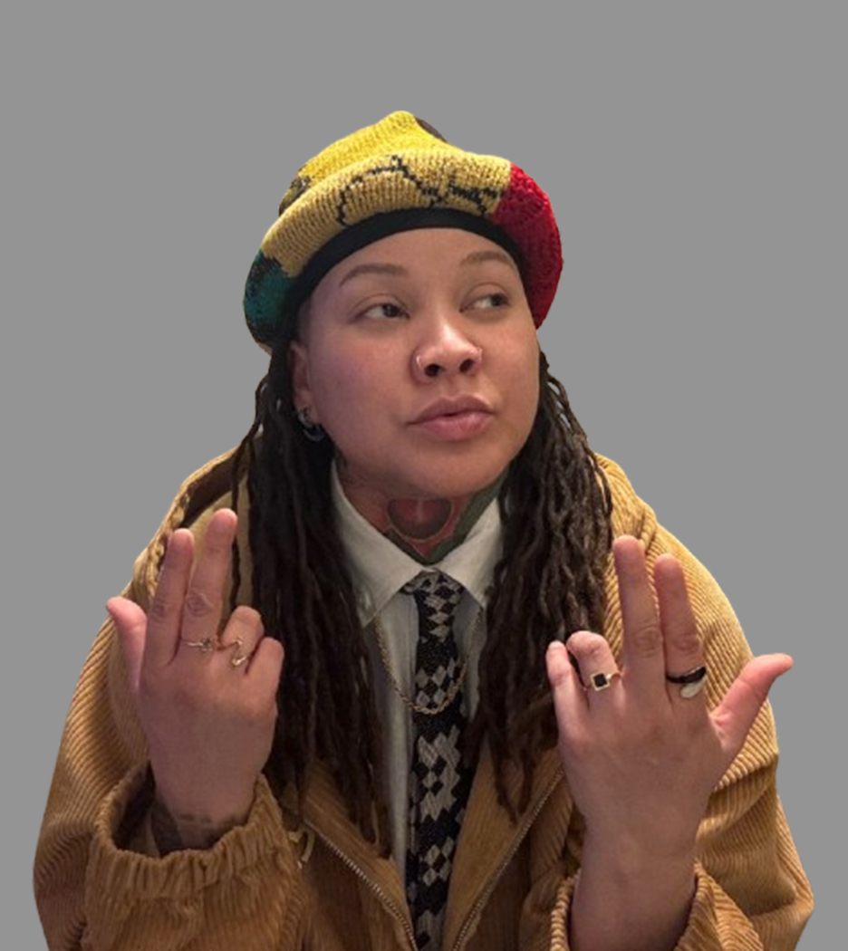 Lyssa True Poet portrait wearing yellow hat and brown coat